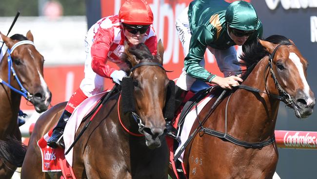 Jockey Craig Williams riding Catchy (C) to win the Ladbrokes Blue Diamond Stakes from Paraiah (R) Blue Diamond Stakes Day at Caulfield Racecourse in Melbourne, Saturday. Feb. 25, 2017. (AAP Image/Mal Fairclough) NO ARCHIVING, EDITORIAL USE ONLY