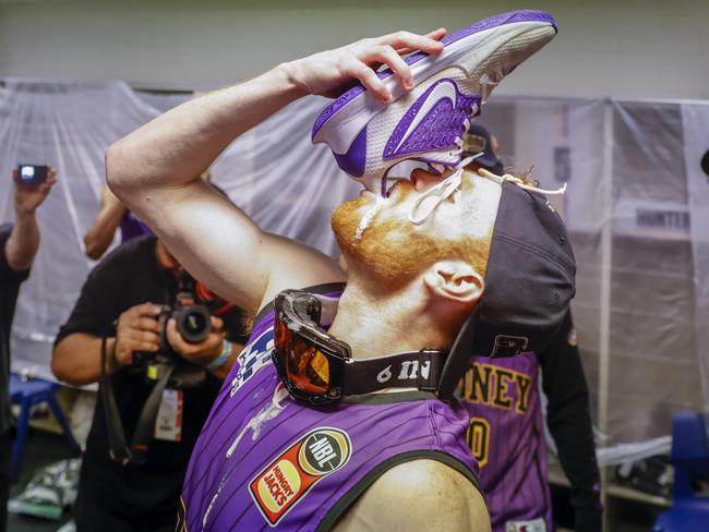 Celebrating a championship with a shoey in Sydney. Picture: Getty Images