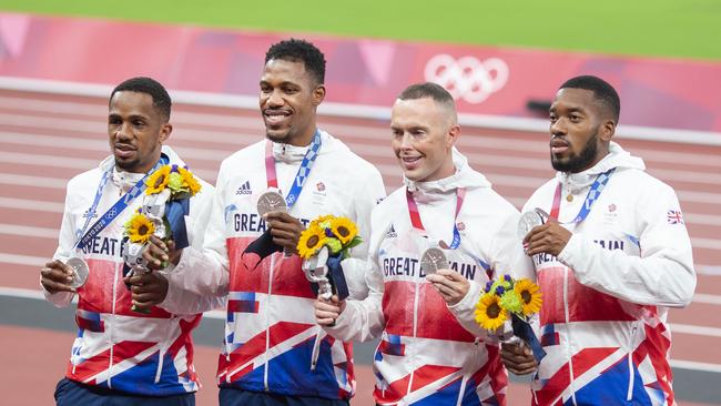 CJ Ujah, Zharnel Hughes, Richard Kilty and Nethaneel Mitchell-Blake of Great Britain with their silver medals. (Photo by Tim Clayton/Corbis via Getty Images