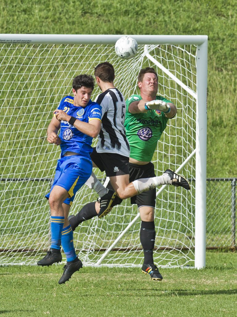 Alex Dyball, USQ and Nikolas Lawson and Matt Eilers, USQ. Football, Willowburn vs USQ. Sunday, 4th Mar, 2018. Picture: Nev Madsen