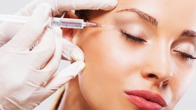 Close up of woman receiving beauty treatment with Botox.