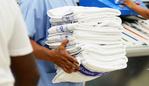 Royal Darwin Hospital staff members prepare the clean towels and laundry to be transported to the Hospital.