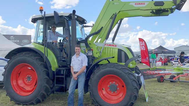 ATTENTION GRABBER: At Casino Primex Class support manager Ian Hockaday (in the cabin) and Dover &amp; Sons sales manager Andrew Leek, said the attractive price of the Claas tractor 620c 140hp of $118,400 plus GST, along with its rugged god kooks, were attracting a great deal of interest, Photo: Alison Paterson