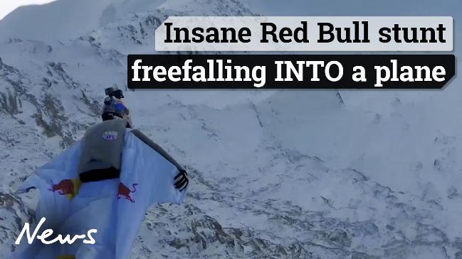 Insane Red Bull stunt freefalling INTO a plane