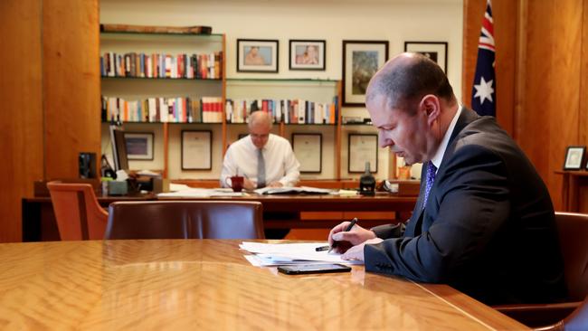 Scott Morrison and Josh Frydenberg at work ahead of perhaps the most important budget since World War II. Picture: Adam Taylor