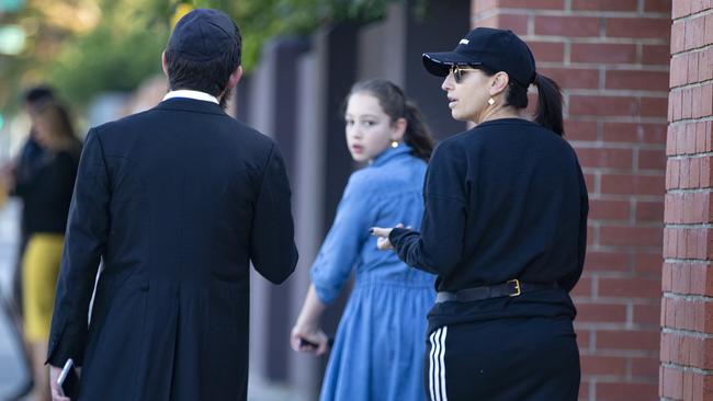 A Yeshivah-Beth Rivkah colleges teacher speaks to parent Miriam Fakas as she walks past the school. Picture: Sarah Matray