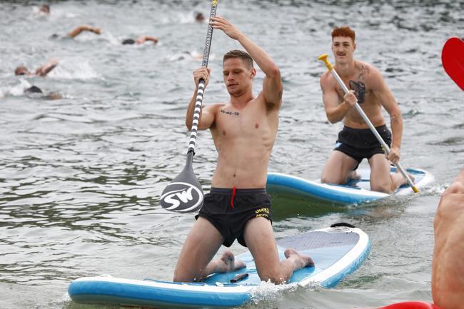 Gold Coast Suns players Jy Farrar (front) and Matt Conroy (back) training at Palm Beach. Picture: Tertius Pickard