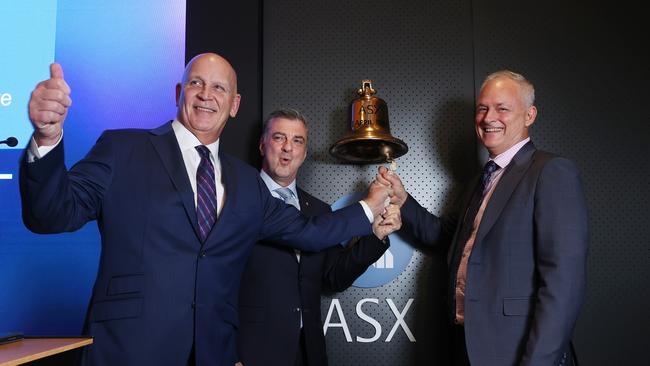 DigiCo managing director Bryan Marsh, chairman Joseph Carrozzi and Global Switch managing director Damon Reid ring in the start of trading on Friday. Picture: John Feder.