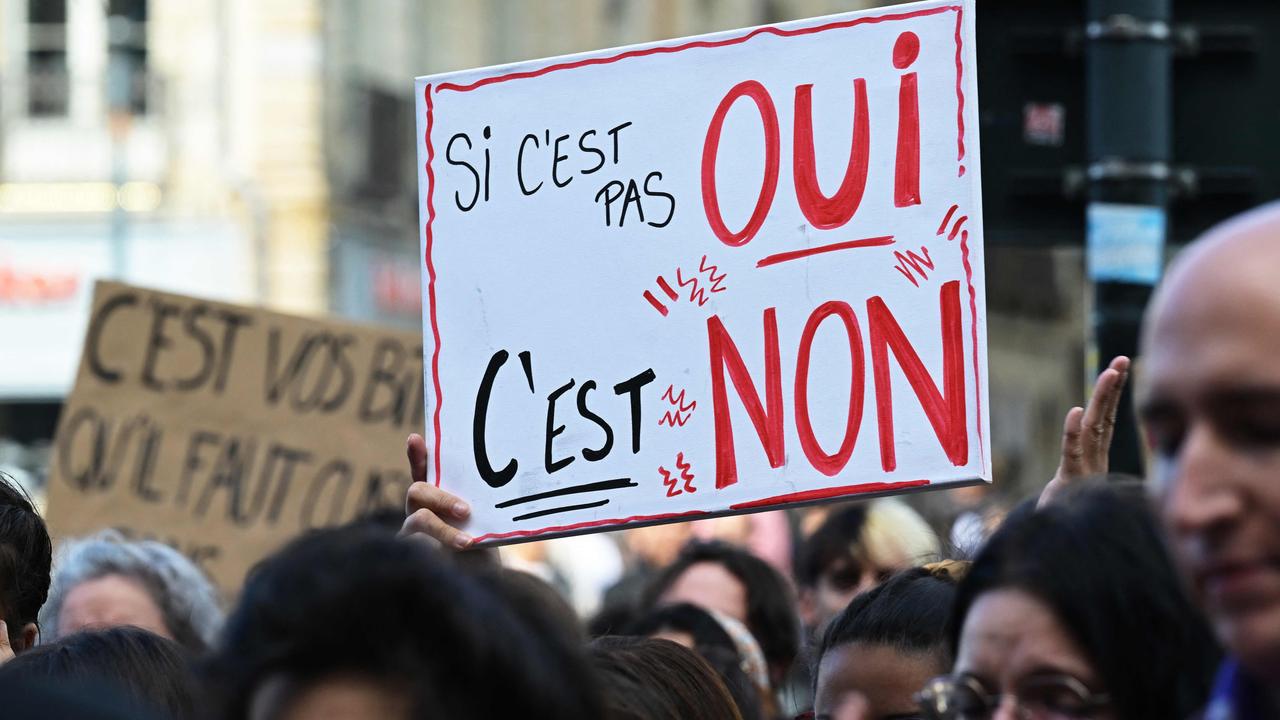 A protester holds a placard reading "If it's not a 'yes', then it's a 'no'". Picture: Damien Meyer /AFP