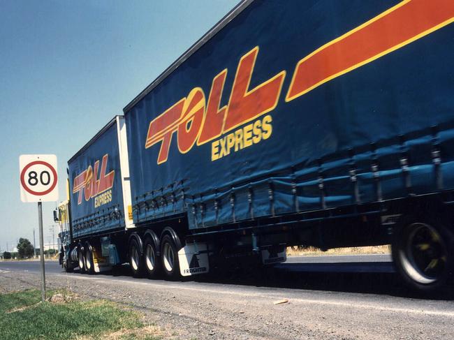 Undated. Toll Holdings Toll Express 25m racked tautliner B-Double semi trailer motor truck. PicSupplied  transport 80 kph road speed sign signs motor vehicles trucks logo logos