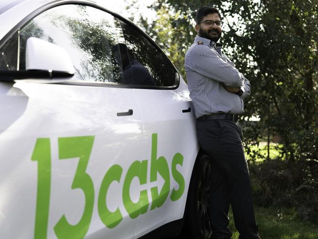 13cabs driver Jatin Parbhakar with the company’s green electric taxi logo. Passengers who hail a 13cabs EV in Sydney, Melbourne and Brisbane on World Transport Day will ride for free.