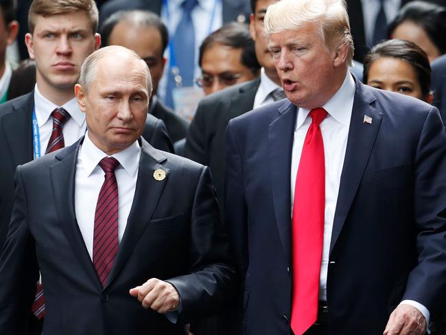 Friends? Putin and Trump at the Asia-Pacific Economic Cooperation (APEC) leaders' summit in Vietnam last year. Picture: AFP/Jorge Silva