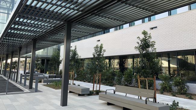 The exterior at the new Northern Beaches Hospital in Frenchs Forest. Seating and plants are in place. Picture: Julie Cross.