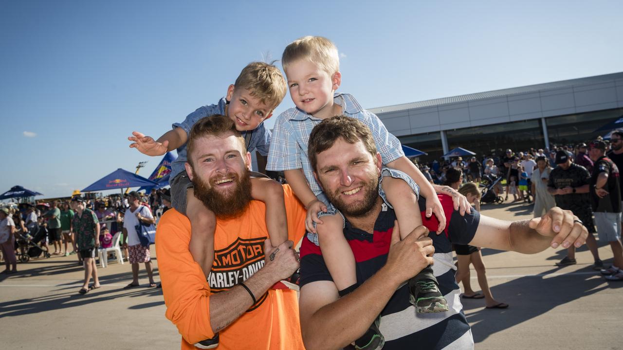Xavier Smith gets a lift from Jordan Curren (left) and Luca Smith on the shoulders of dad Russell Smith as V8 Supercars team Red Bull Ampol Racing launch their 2024 livery at Toowoomba Wellcamp Airport, Saturday, February 3, 2024. Picture: Kevin Farmer