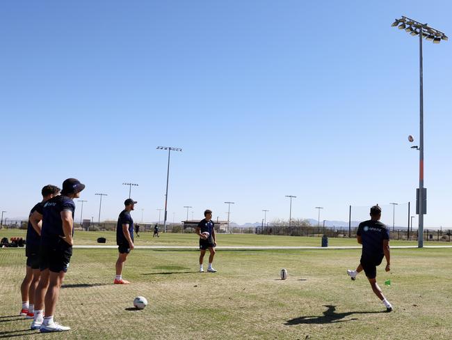 Warriors players using a light post for kicking practice as there are no goalposts at James Regional Sports Park in Las Vegas. Picture: Jonathan Ng