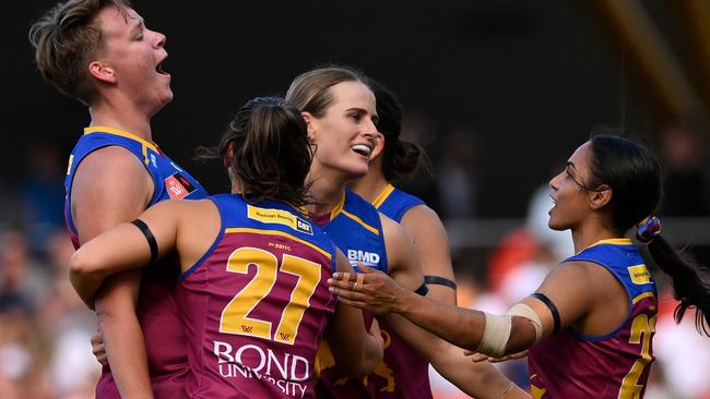 Dakota Davidson celebrates kicking a goal with teammates. Picture: Matt Roberts/Getty Images