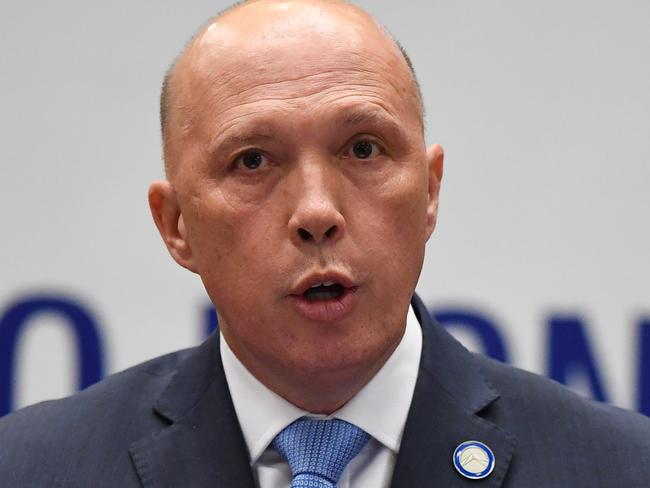 The Minister for Home Affairs Peter Dutton delivers the opening address at the No Money for Terror Ministerial Conference on Counter-Terrorism Financing at the Melbourne Exhibition and Convention Centre in Melbourne, Thursday, November 7, 2019. (AAP Image/Julian Smith) NO ARCHIVING