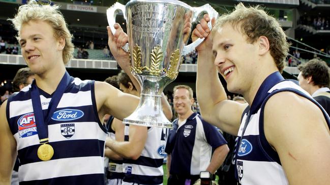 Nathan Ablett and Gary Ablett Jr hold the 2007 premiership cup aloft.