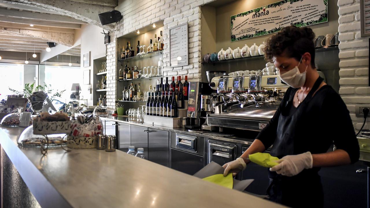 The stimulus package hopes to keep people spending in small businesses like cafes. Picture: Claudio Furlan/LaPresse via AP