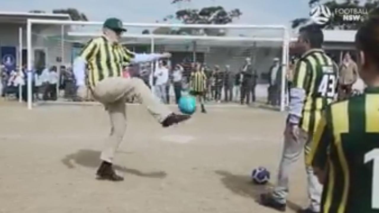 Scott Morrison has a kick during the Lilli Pilli Clubhouse opening. Picture: Football NSW