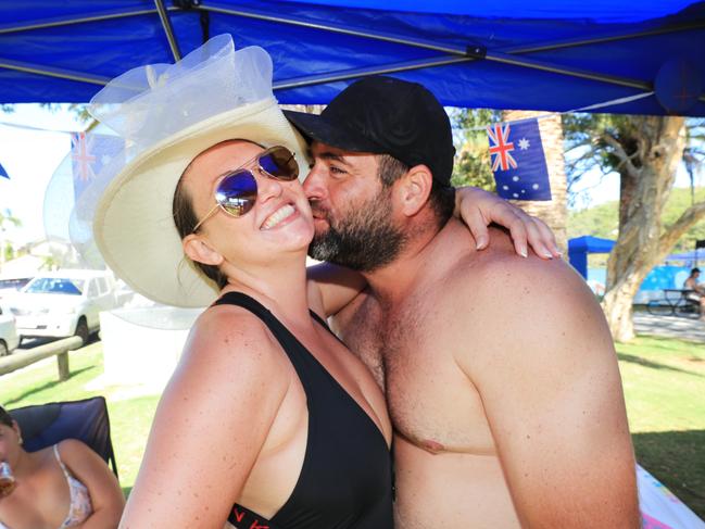 Toby Tuckers Watts and Natalie Volep love it up while Celebrating Australia Day at Burleigh Heads. Photo: Scott Powick