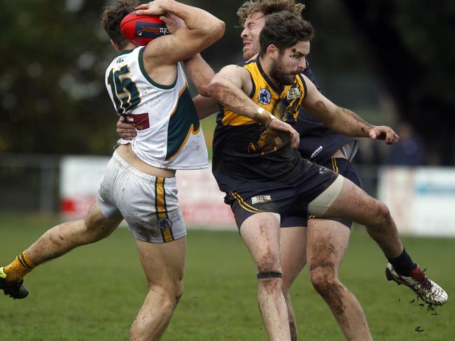 NFL footy: Whittlesea V Northcote Park at Whittlesea Showgrounds. Luke Svarc from Northcote Park and Matthew Atta and Jai Robinson 8 from Whittlesea. Picture: Richard Serong