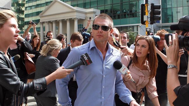 Ben Cousins mobbed by media outside a court appearance in Perth in 2012. Picture: Getty