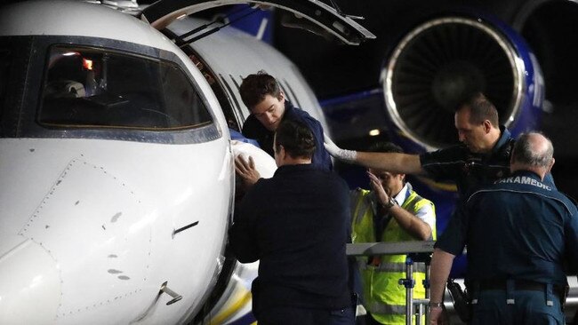 Injured workers from an explosion at Grosvenor coal mine at Moranbah arriving in Brisbane. Picture: AAP