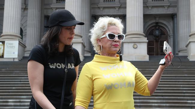 Protest groups face off in front of the Victorian parliament where UK far right activist Kellie-Jay Keen (AKA, Posie Parker) (R) is due to speak. MP Moira Deeming is pictured with Keen. Picture: NCA NewsWire / David Crosling