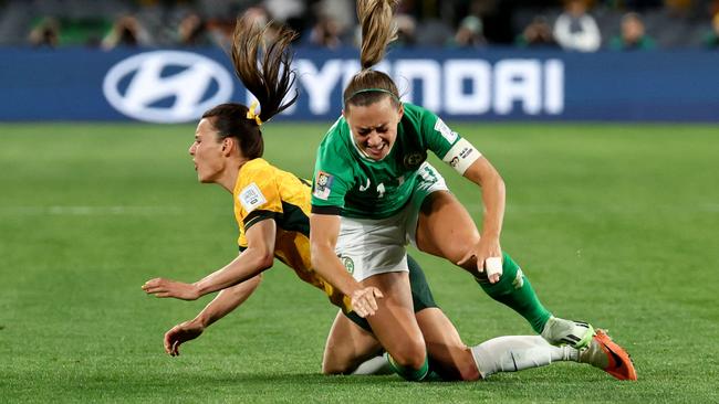 Hayley Raso and Katie McCabe clash. Picture: AFP