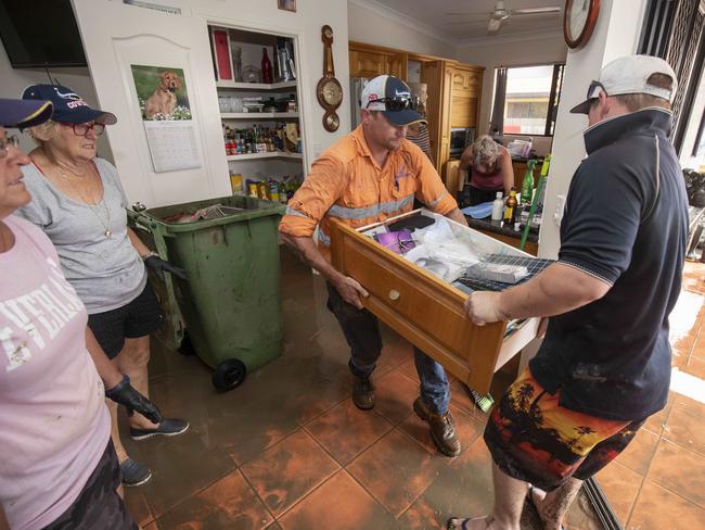 The clean-up begins at a home in Idalia, Townsville. Picture: Glenn Hunt