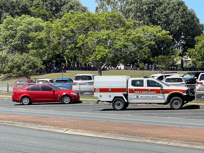 Students at Fitzgerald State School, North Mackay, were evacuated to the oval after smoke was reported coming out of a classroom around 12.50pm on October 21, 2024. Picture: Fergus Gregg