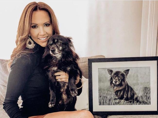 Kyly Clarke with her dog who was illustrated in a portrait by her friend Carley Anne Walsh. Picture: Instagram/Carley Anne Art