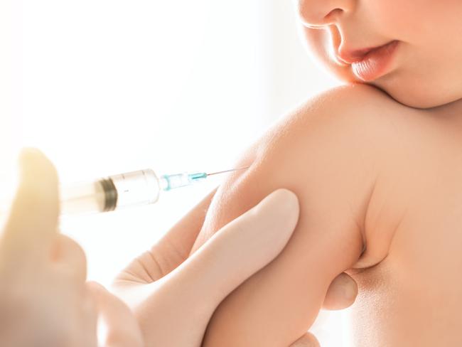 A doctor making a vaccination to a child istock image