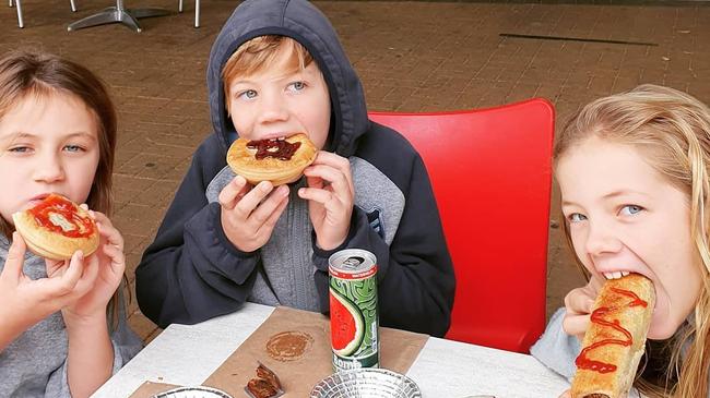 Scott and Nadia’s children Piper (right), Hudson (centre) and Charlie tuck into some of the bakery’s best pies and sausage rolls. Picture: Scotty's Bakehouse