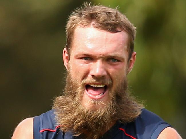 MELBOURNE, AUSTRALIA - FEBRUARY 23: Max Gawn of the Demons handballs during a Melbourne Demons AFL training session at AAMI Park on February 23, 2016 in Melbourne, Australia. (Photo by Quinn Rooney/Getty Images)