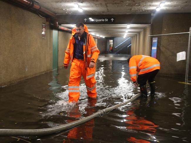 The Macquarie St exit of St James station flooded. Picture: John Grainger