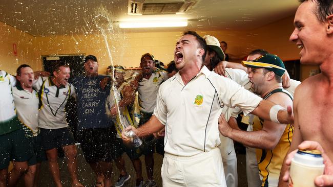 Richie Hodgson and the PINT team celebrate their 2014 Premier Grade grand final victory over Waratah. Picture: Katrina Bridgeford