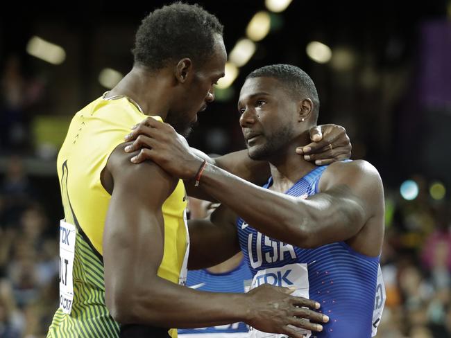 Gold medal winner United States' Justin Gatlin, right, embraces Jamaica's Usain Bolt.