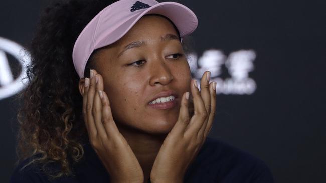 Naomi Osaka answers questions after her Australian Open victory.