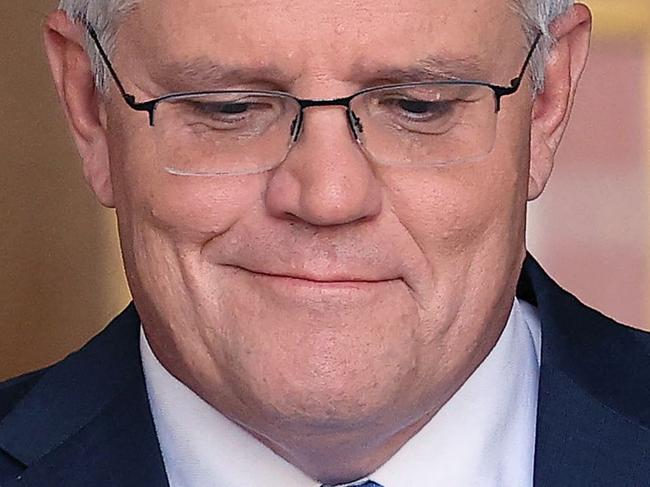 Australia's Prime Minister Scott Morrison attends a press conference at Parliament House in Canberra on April 10, 2022. - Australian Prime Minister Scott Morrison on April 10 called federal elections for May 21, launching a come-from-behind battle to stay in power after three years rocked by floods, bushfires and the Covid-19 pandemic. (Photo by AFP)