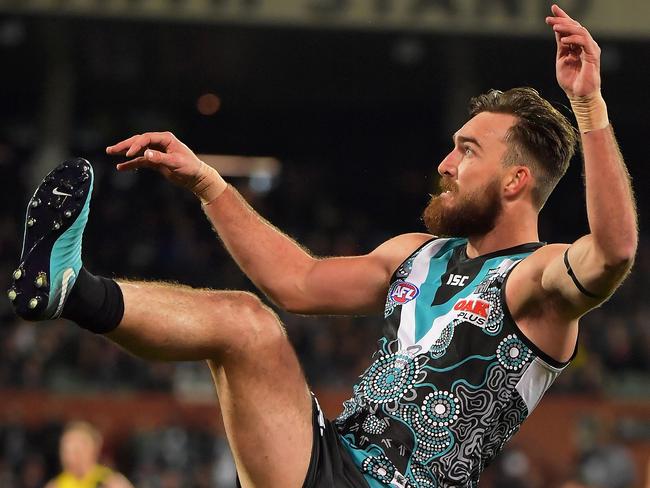 ADELAIDE, AUSTRALIA - JUNE 08: Charlie Dixon of the Power kicks the ball during the round 12 AFL match between the Port Adelaide Power and the Richmond Tigers at Adelaide Oval on June 8, 2018 in Adelaide, Australia.  (Photo by Daniel Kalisz/Getty Images)