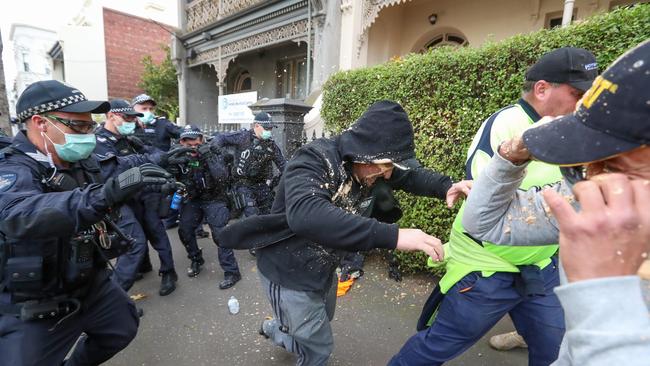 A rally organised by a group dubbed "Health Rights Alliance" in Flagstaff Gardens in Melbourne on Saturday. Police arrest a group in North Melbourne after walking away from the park. Picture: Alex Coppel.