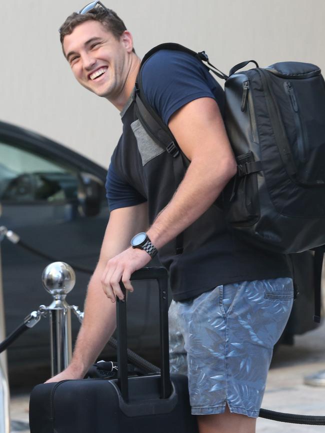 Corey Oates arrives with his bags at Maroons camp yesterday.