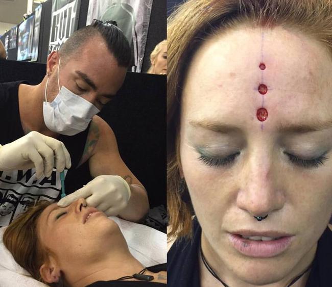 Facebook image of Brendan Russell performing a scarification procedure on a woman at a New Zealand tattoo expo.