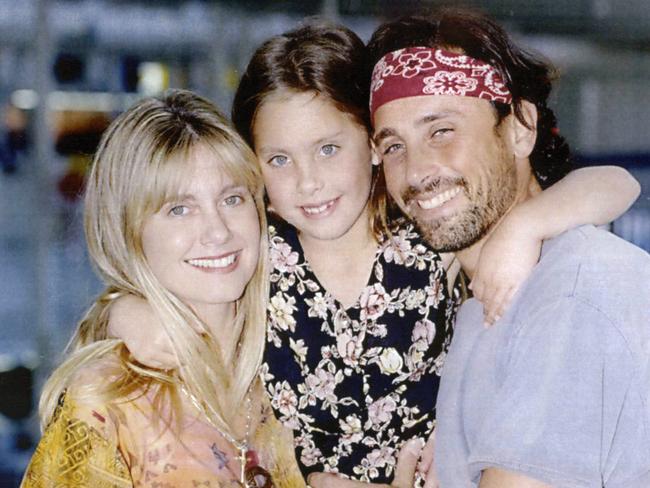 Family ... Olivia Newton-John, with daughter Chloe and then husband Matt Lattanzi in Sydney in 1993.