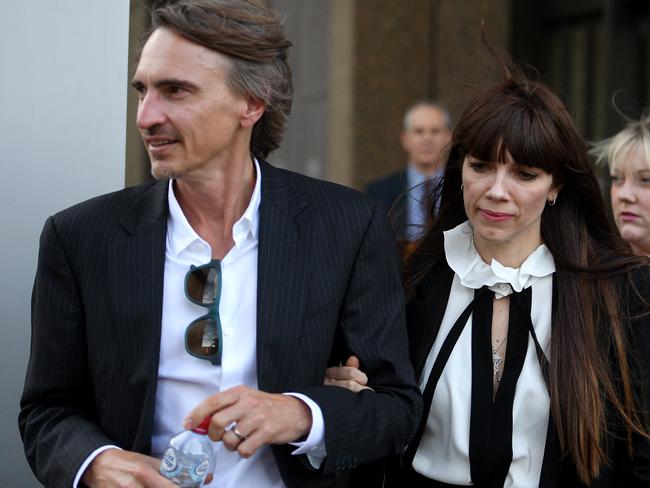 Australian author Kate Morton (right) leaves the NSW Supreme Court in Sydney with her husband Davin Patterson. Picture: AAP Image/Dan Himbrechts