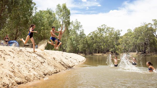 Kids cool off at Dolan's Beach on the Murrumbidgee river at Darlington Point, NSW on Sunday afternoon. Picture: Ginette Guidolin