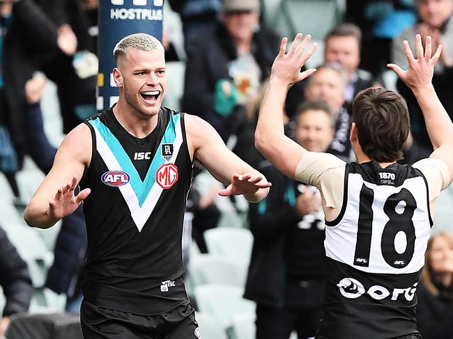 ADELAIDE, AUSTRALIA - AUGUST 08: Peter Ladhams of Port Adelaide celebrates the first goal with Zak Butters of Port Adelaide during the round 11 AFL match between the Port Adelaide Power and the Richmond Tigers at Adelaide Oval on August 08, 2020 in Adelaide, Australia. (Photo by Mark Brake/Getty Images)