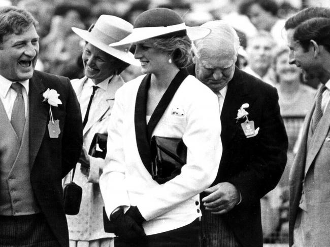 Princess Diana and Prince Charles share a joke with businessman John Elliott at the Melbourne Cup, during their Royal Tour of Australia in 1985